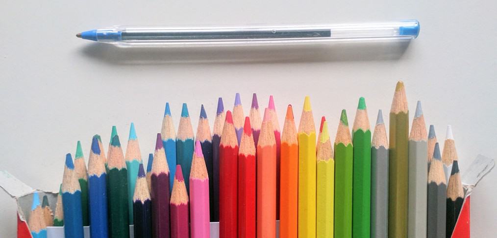 Coloured pencils and pen
